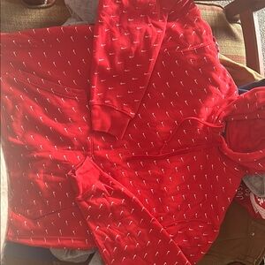Nike Red Hoodie with White Swoosh Pattern